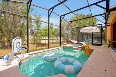 a swimming pool in a house with an igloo at 5BR Disney Villa with Private Pool & Spa in Kissimmee