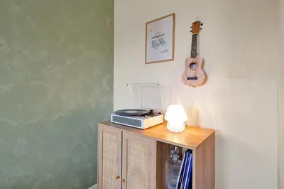 a table with a radio and a guitar on a wall at 5BR Disney Villa with Private Pool & Spa in Kissimmee