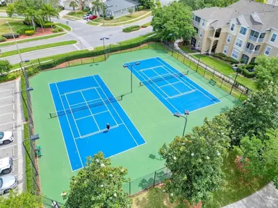 an overhead view of two tennis courts in a city at 8102-3-PP-Vacation getaway condo at Windsor in Kissimmee