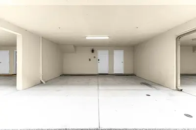 an empty room with white walls and white doors at Sunny Sales - Renovated TownHome by Disney! in Orlando
