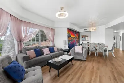 a living room with a couch and a table at Fabulous Condo at World Quest Resort Disney area in Orlando