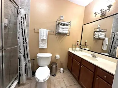 a bathroom with a toilet and a shower and a sink at 2 Bedrooms 2 Bathrooms Secret Lake 3176-204 in Kissimmee