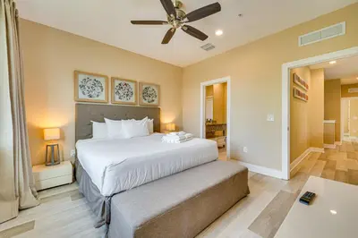 a bedroom with a bed and a ceiling fan at Less Than 2 Mi to WDW Attractions Luxe Family Getaway! in Orlando
