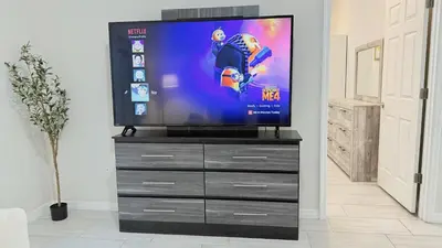 a television on top of a dresser in a room at Entire House in Orlando close to All Parks in Orlando
