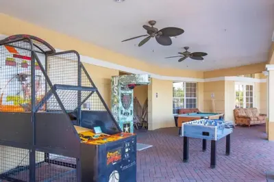 a living room with a play area with a table at Vista Cay Resort in Orlando