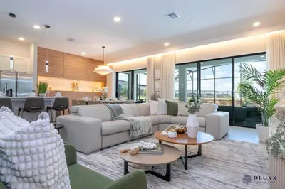 a living room with a couch and a table at Brand New DLuxx Top Elegance Vacation Home 1018 in Orlando