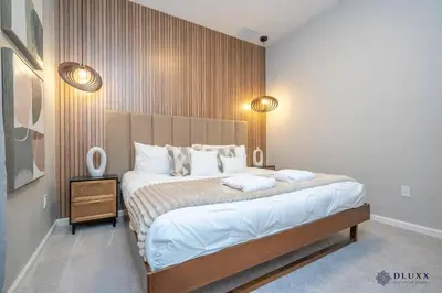 a bedroom with a large bed with two pillows at Brand New DLuxx Top Elegance Vacation Home 1018 in Orlando