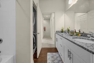 a bathroom with two sinks and a walk in shower at Dluxx Perfect Townhouse next to Disney Parks 3204 in Kissimmee