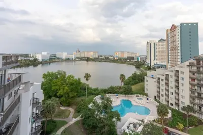 a view of a lake in a city with buildings at Amazing 2 Bedrooms Nex to Universal in Orlando