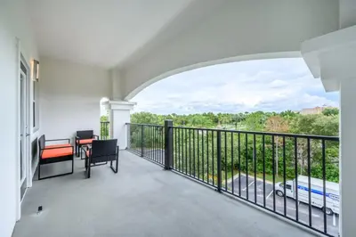 a balcony with a view of a street at Top Floor Modern Vista Cay Reserve Condo - 5004 in Orlando