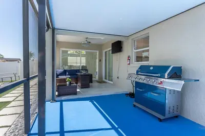 a kitchen with a blue stove in a living room at Villa Resort Club in Kissimmee