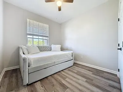 a living room with a couch and a window at Beautiful Three bed condo, Minutes from Disney condo in Kissimmee