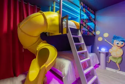 a room with a bunk bed and a ladder at Brand New Home 8 BedroomsPoolSleeps 26 in Kissimmee