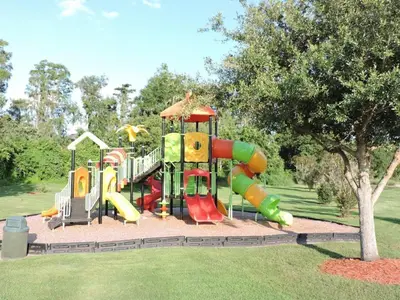 a playground with a slide in a park at 4701-Lake Berkley villa- Renovated 3 bed in Kissimmee