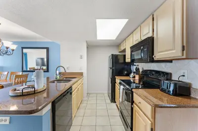 a kitchen with a sink and a stove at Disney-Area Kissimmee 3BR | Community Pool in Kissimmee