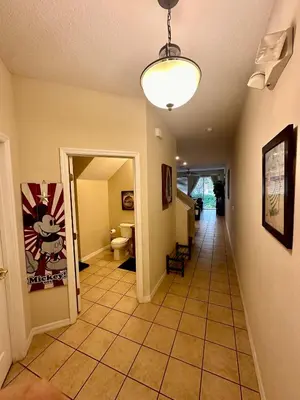 a hallway with a hallway leading to a room at Grand Panoramic 3BR Townhouse Near Disney Parks in Kissimmee