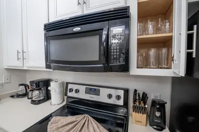 a kitchen with a microwave and a stove at Stunning 3 bedroom 3 bath townhome 370 in Kissimmee