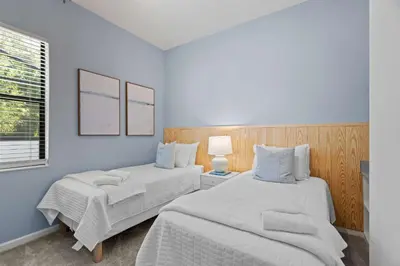 a bedroom with two beds and a window at Luxury Paradise in Orlando Best Location in Orlando