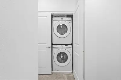 a laundry room with two washing machines in a room at Luxury Paradise in Orlando Best Location in Orlando