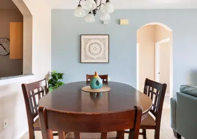 a dining room with a wooden table and chairs at Making Memories At Windsor Palms Resort, Great Amenities And Much More Fun! in Kissimmee