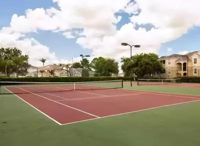 a tennis court with two tennis courts at Making Memories At Windsor Palms Resort, Great Amenities And Much More Fun! in Kissimmee
