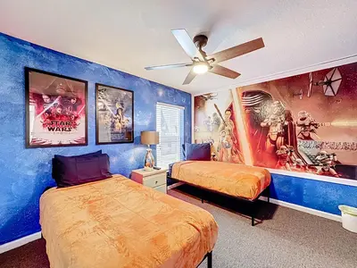a bedroom with two beds and a ceiling fan at Free Water Park-Close to Disney-3 King-POOL-SPA in Orlando