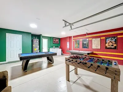 two ping pong tables in a room with colorful walls at Free Water Park-Close to Disney-3 King-POOL-SPA in Orlando