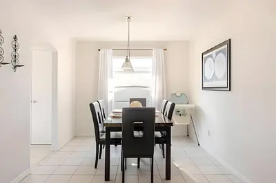 a dining room with a table and chairs at Lakeside View Pool Home, close to Disney, Malls in Kissimmee