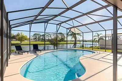 an image of a swimming pool in a building with a glass roof at Lakeside View Pool Home, close to Disney, Malls in Kissimmee