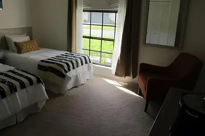 a hotel room with two beds and a window at Premium Pool Villa Centrally Located near Disney in Kissimmee