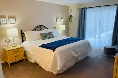 a bedroom with a large bed and a window at Huge Lot, Private Pool Home Centrally Located in Kissimmee