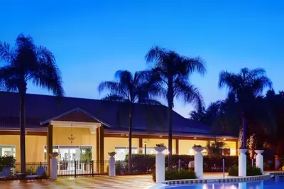 a house with palm trees and a swimming pool at Encantada Resort, Pool, close to Disney in Kissimmee