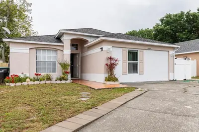 a white house with at Private 1 Bed 1 Bath Orlando Oasis Shopping and Parks Nearby in Orlando
