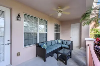 a living room with a couch and a window at Luxury Lakeview, Vista Cay Orlando 1027 in Orlando