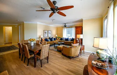 a living room with a ceiling fan and a dining room at Gorgeous 3 Bed Lakeview, Vista Cay - 1010 in Orlando