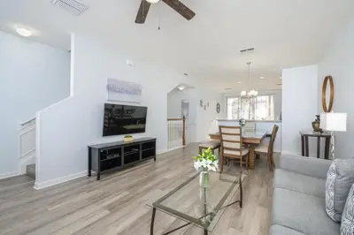 a living room with a couch and a table at Beautiful Townhome, Vista Cay Resort Direct - 4010 in Orlando