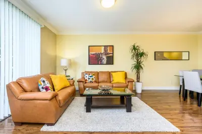 a living room with a couch and a table at New Modern Townhome, Near The Parks - 4030 in Orlando