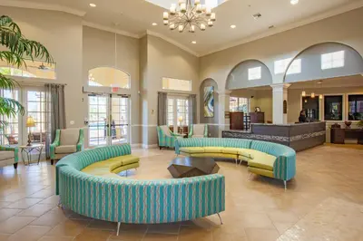 a lobby with couches and tables in a building at New Gorgeous Townhome, Epic Universe, Vista Cay - 4008 in Orlando