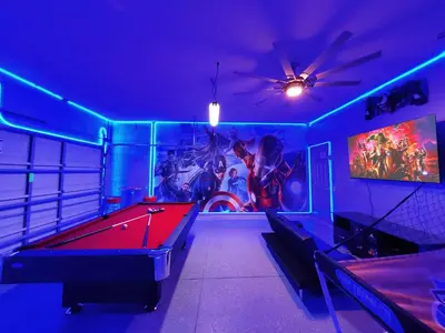 a room with a pool table and a painting on the wall at Windsor Hills Resort - Disney Dream Palace in Orlando