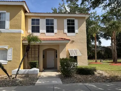 a house with a solar panel on the front of it at Relax and unwind in this Cozy Home Away from Home in Kissimmee