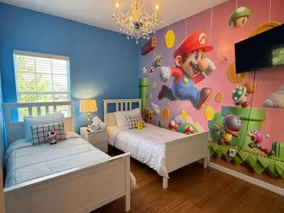 a bedroom with a mario game mural on the wall at 2335 Amazing 5BD Family Townhome Close to Disney in Kissimmee