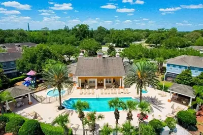 an aerial view of a house with a swimming pool at 2335 Amazing 5BD Family Townhome Close to Disney in Kissimmee