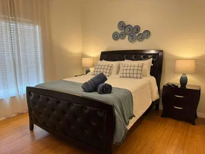 a bedroom with a bed with two pillows on it at 2335 Amazing 5BD Family Townhome Close to Disney in Kissimmee