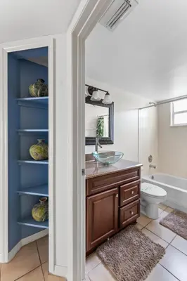a bathroom with a sink and a toilet and a tub at Disney-Area Kissimmee 3BR | Community Pool in Kissimmee