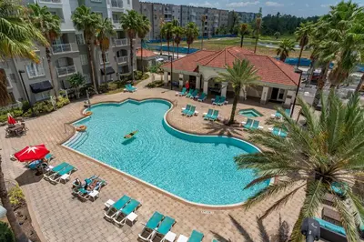 an overhead view of a swimming pool at a resort at King Queen Spacious Studio Near Universal in Orlando