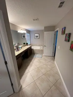 an empty kitchen with a sink and a tub at Relaxing Villa very close to Disney and Universal in Kissimmee