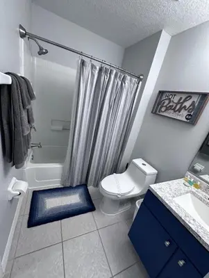 a bathroom with a toilet and a shower at Holiday Haven at Terra Verde Resort in Kissimmee