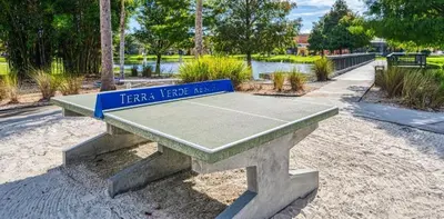 a ping pong table with a tennis court on it at Holiday Haven at Terra Verde Resort in Kissimmee