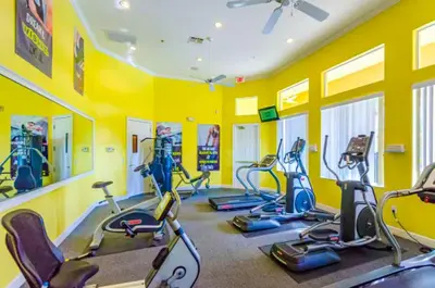 a gym with several exercise bikes in a room at Holiday Haven at Terra Verde Resort in Kissimmee