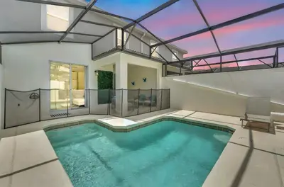 an indoor swimming pool in a house at Storey Lake Escape with Pool in Kissimmee